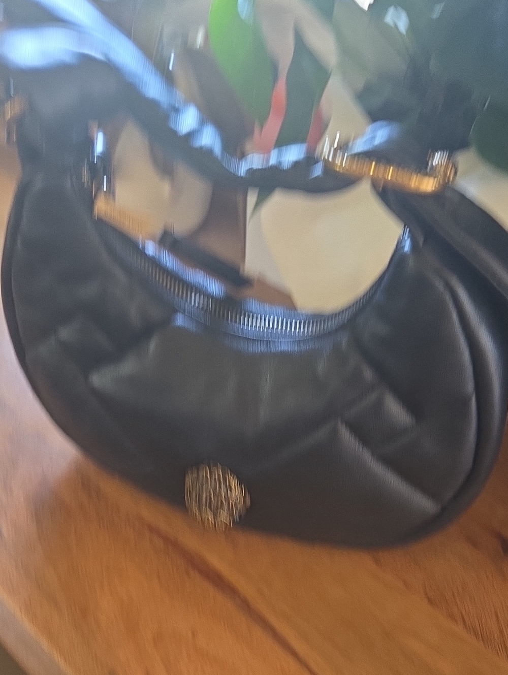 Black Quilted Crescent Shoulder Bag with Gold Accent